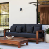 Cali outdoor sofa in Coal styled in patio